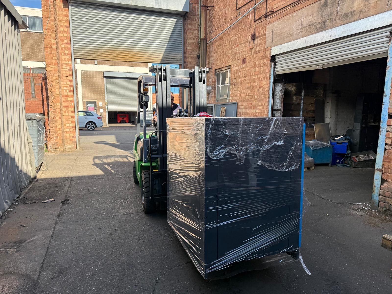 Tanair variable speed compressor being positioned during installation